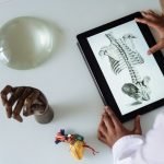 Student studying anatomy on a tablet